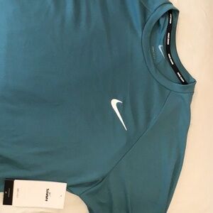 Long sleeve Nike dry, fit, swim shirt, size medium color, green iNWT